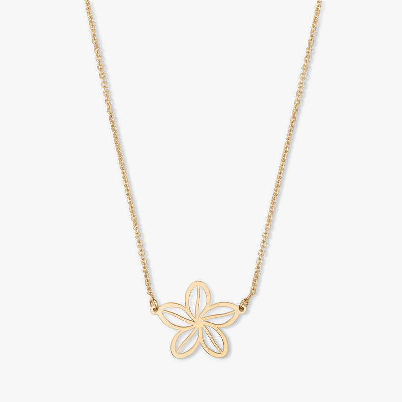Collier en or avec un pendentif en forme de fleur sur fond blanc.